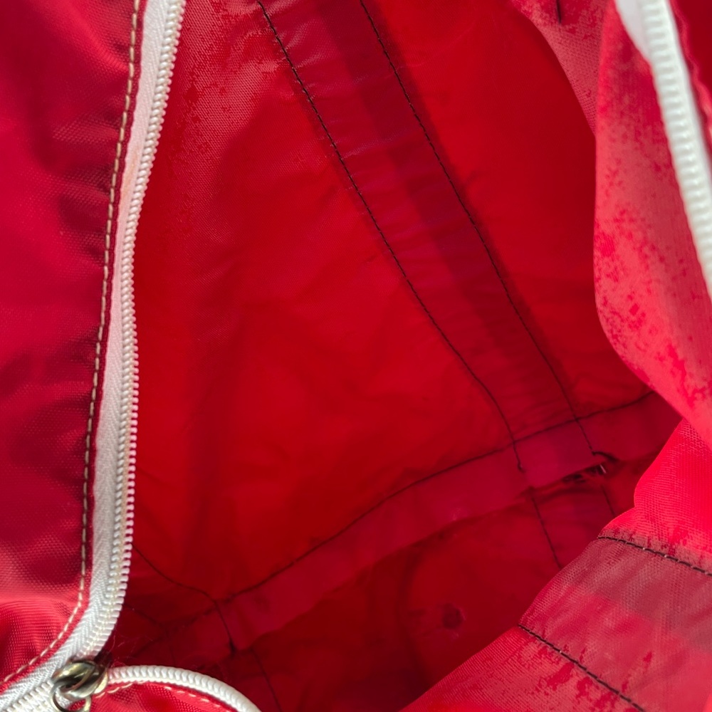 Nylon Red Duffle Bag with Rainbow handles.